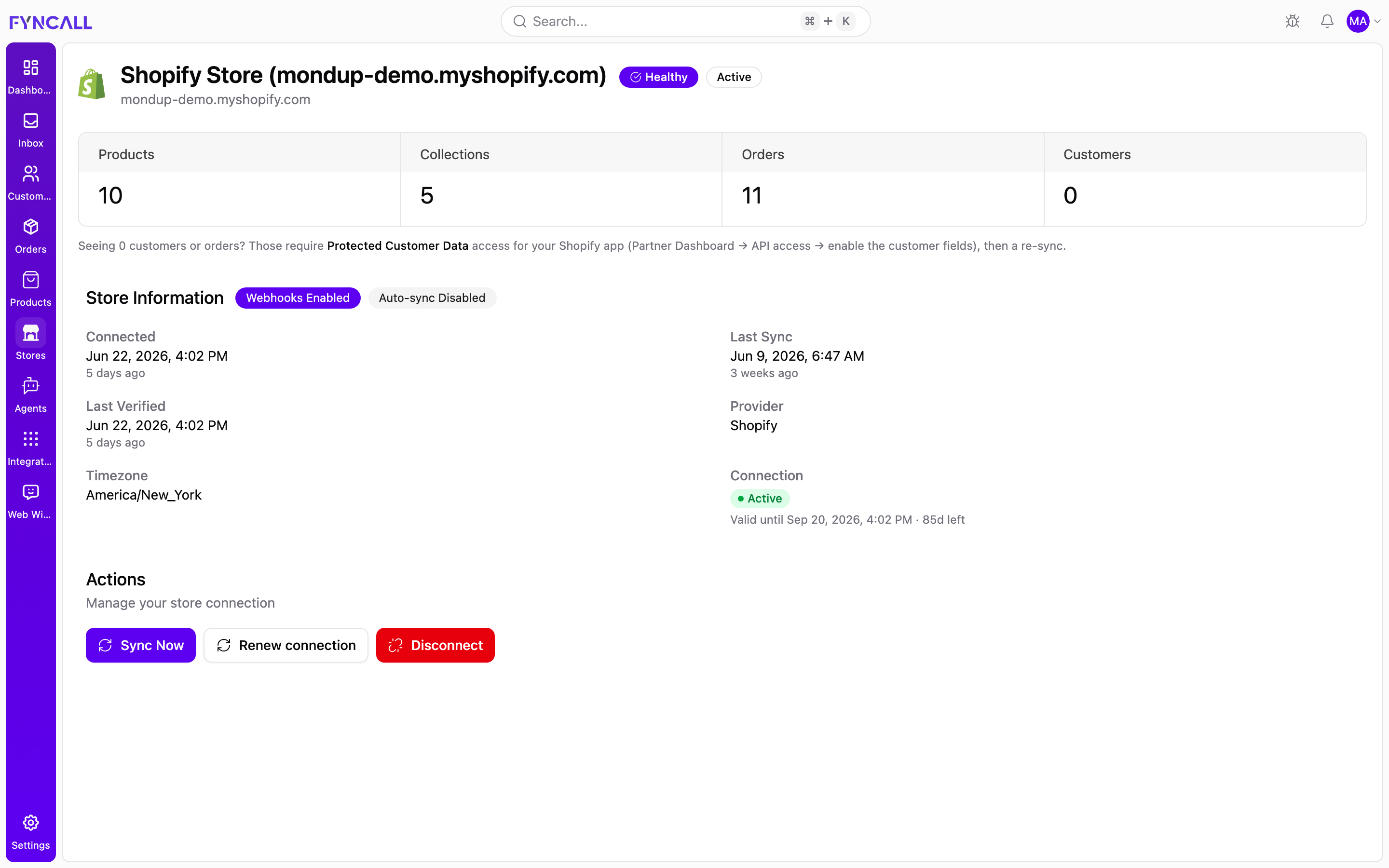 The Stores page showing a connected Shopify store with sync metrics, store information, and management actions